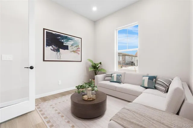 a living room with furniture and window