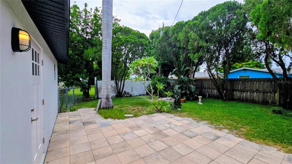 115 15th Avenue Southwest Largo, FL 33770 - Photo 12 of 13 a front view of a house with garden