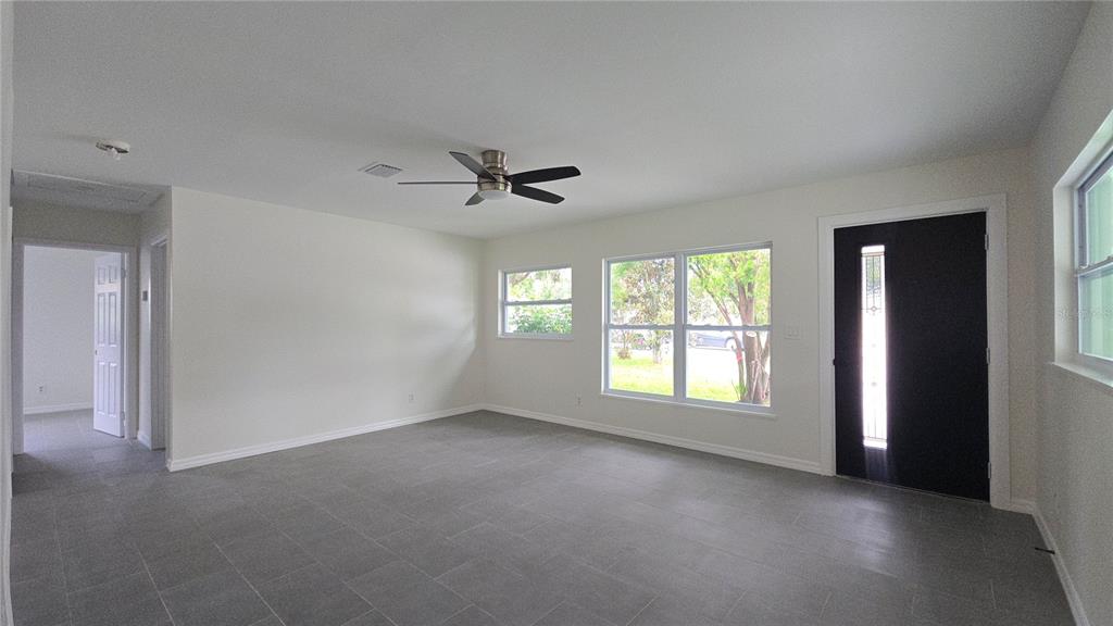 115 15th Avenue Southwest Largo, FL 33770 - Photo 2 of 13 a view of an empty room with a window