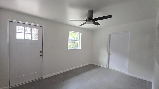 a view of empty room with windows