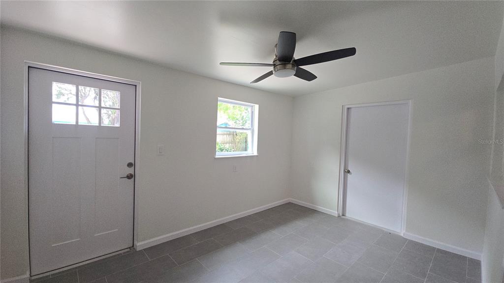 115 15th Avenue Southwest Largo, FL 33770 - Photo 4 of 13 a view of empty room with windows
