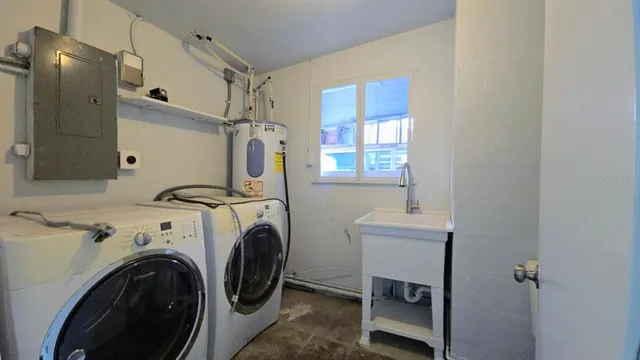 a utility room with dryer and washer