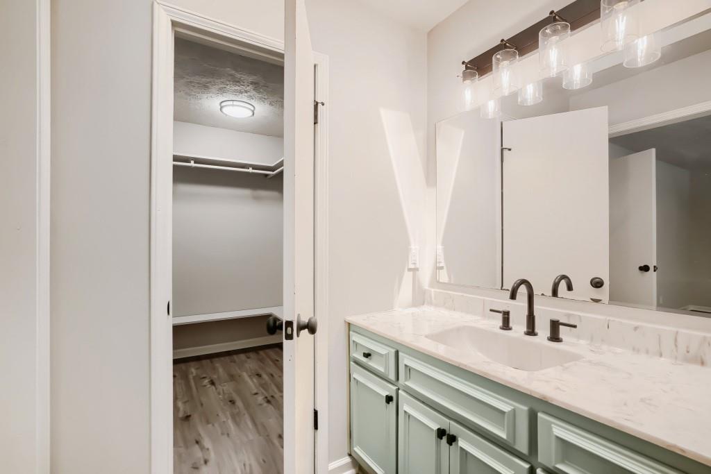 2021 Irwin Bridge Road Northwest Conyers, GA 30012 - Photo 31 of 43 a bathroom with a sink and a mirror