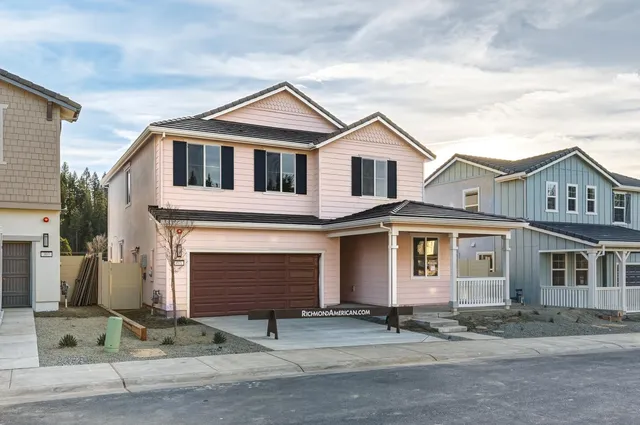 a front view of a house with yard