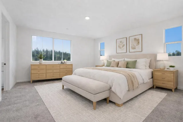 a bedroom with a bed and window