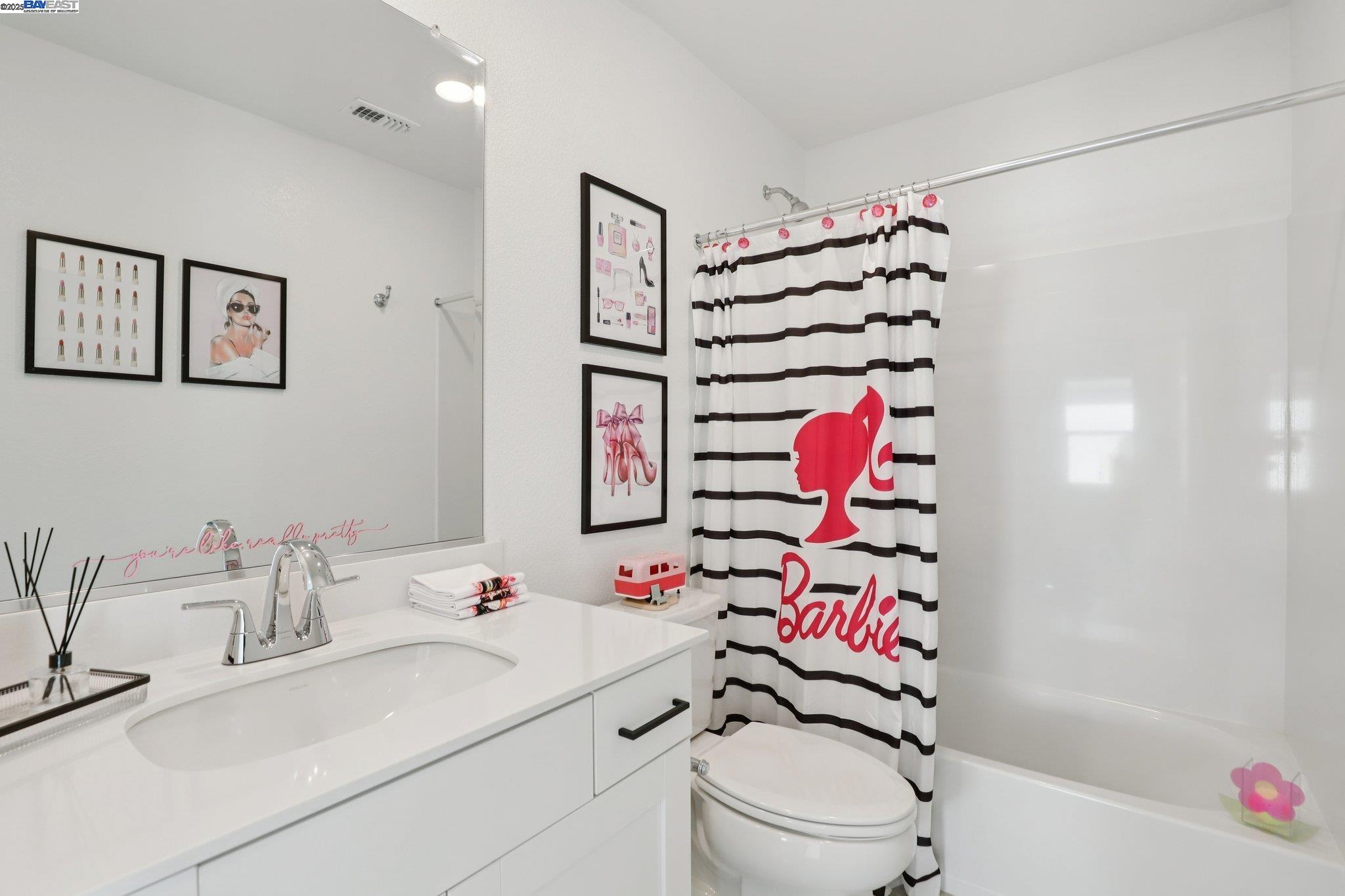 860 Pecan Tree Lane Galt, CA 95632 - Photo 21 of 31 a bathroom with a sink toilet and shower