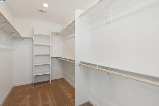 a view of an empty walk in closet