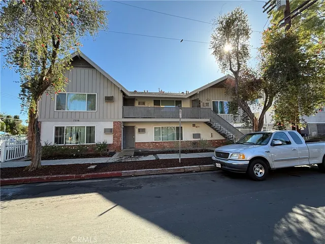 a front view of a house with parking space