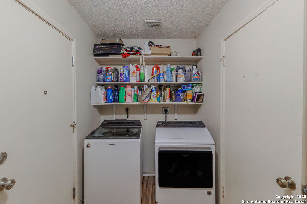 744 County Road 2651 Rio Medina, TX 78066 - Photo 15 of 29 a room with storage and utility