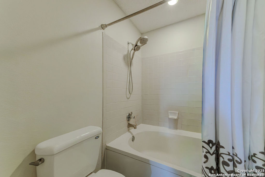 744 County Road 2651 Rio Medina, TX 78066 - Photo 15 of 27 a bathroom with a sink a toilet and shower