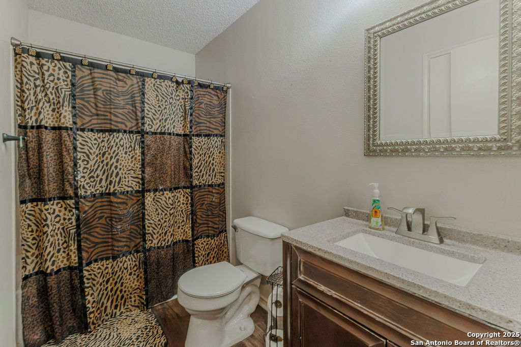744 County Road 2651 Rio Medina, TX 78066 - Photo 26 of 29 a bathroom with a sink toilet and shower