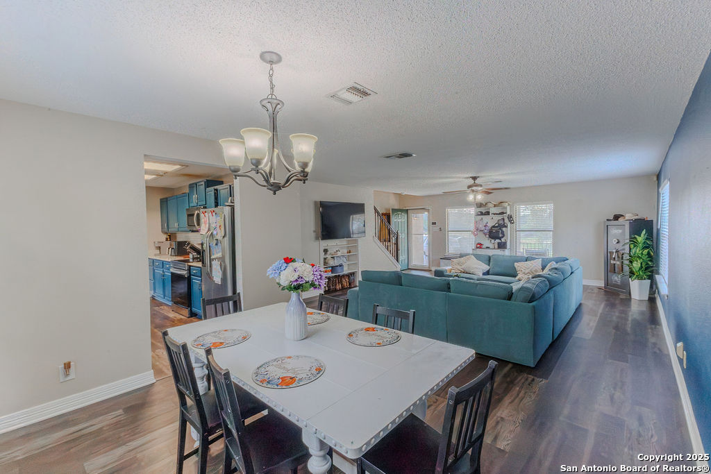 744 County Road 2651 Rio Medina, TX 78066 - Photo 5 of 27 a view of a dining room with furniture and wooden floor