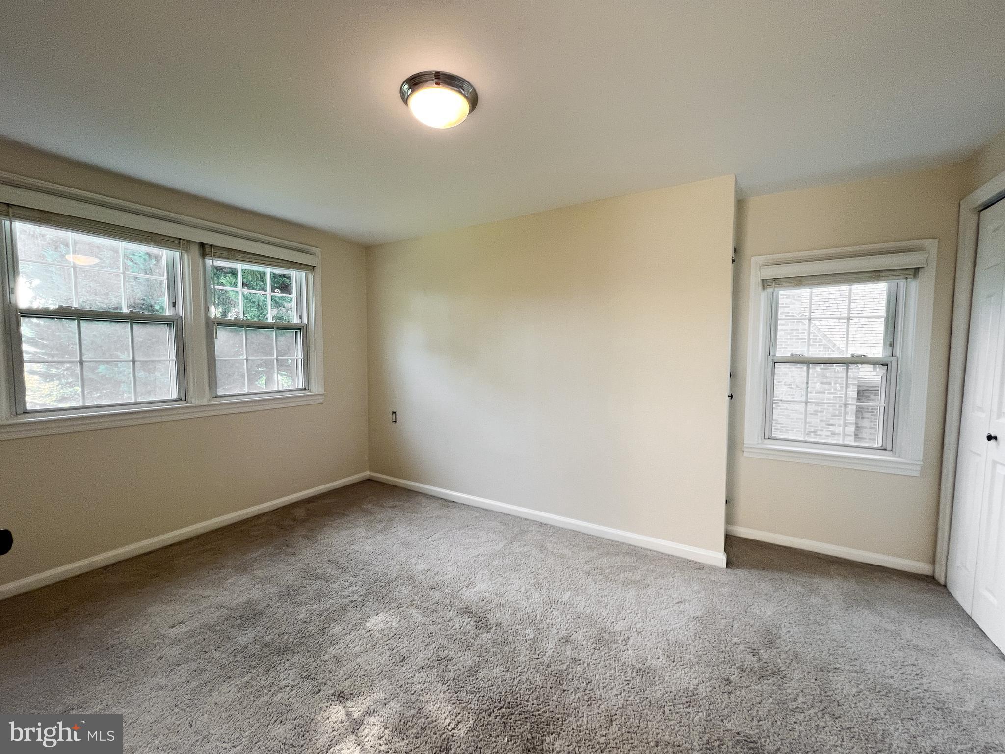 10159 Sutherland Road Silver Spring, MD 20901 - Photo 20 of 30 an empty room with windows