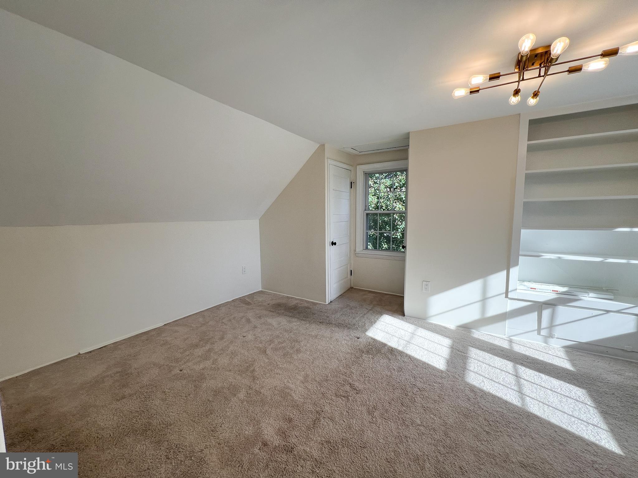 10159 Sutherland Road Silver Spring, MD 20901 - Photo 25 of 30 a view of a livingroom and a bathroom with bathtub