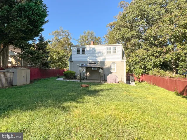 a view of back yard of the house with an outdoor space