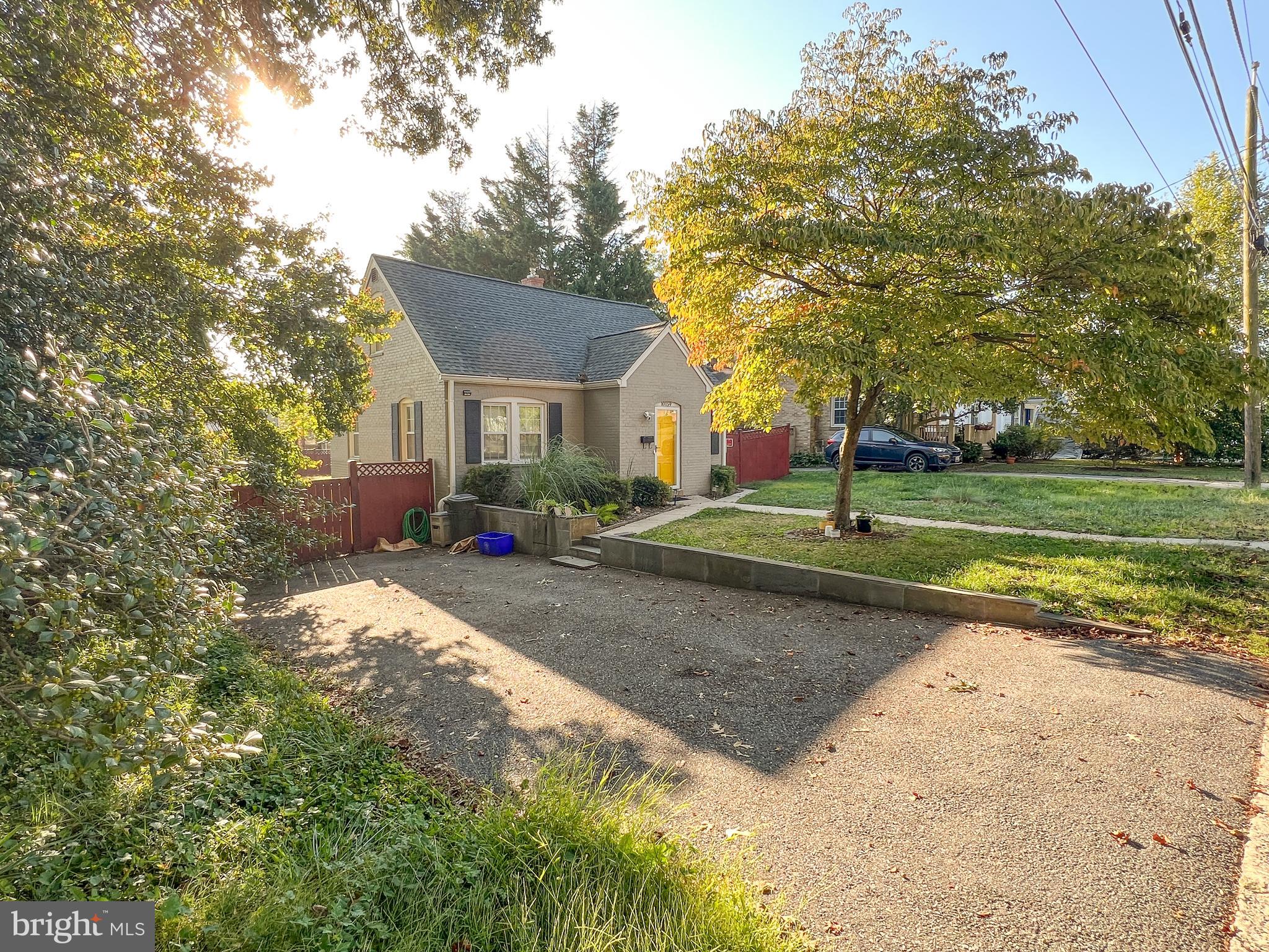 10159 Sutherland Road Silver Spring, MD 20901 - Photo 4 of 30 a view of a house with a yard