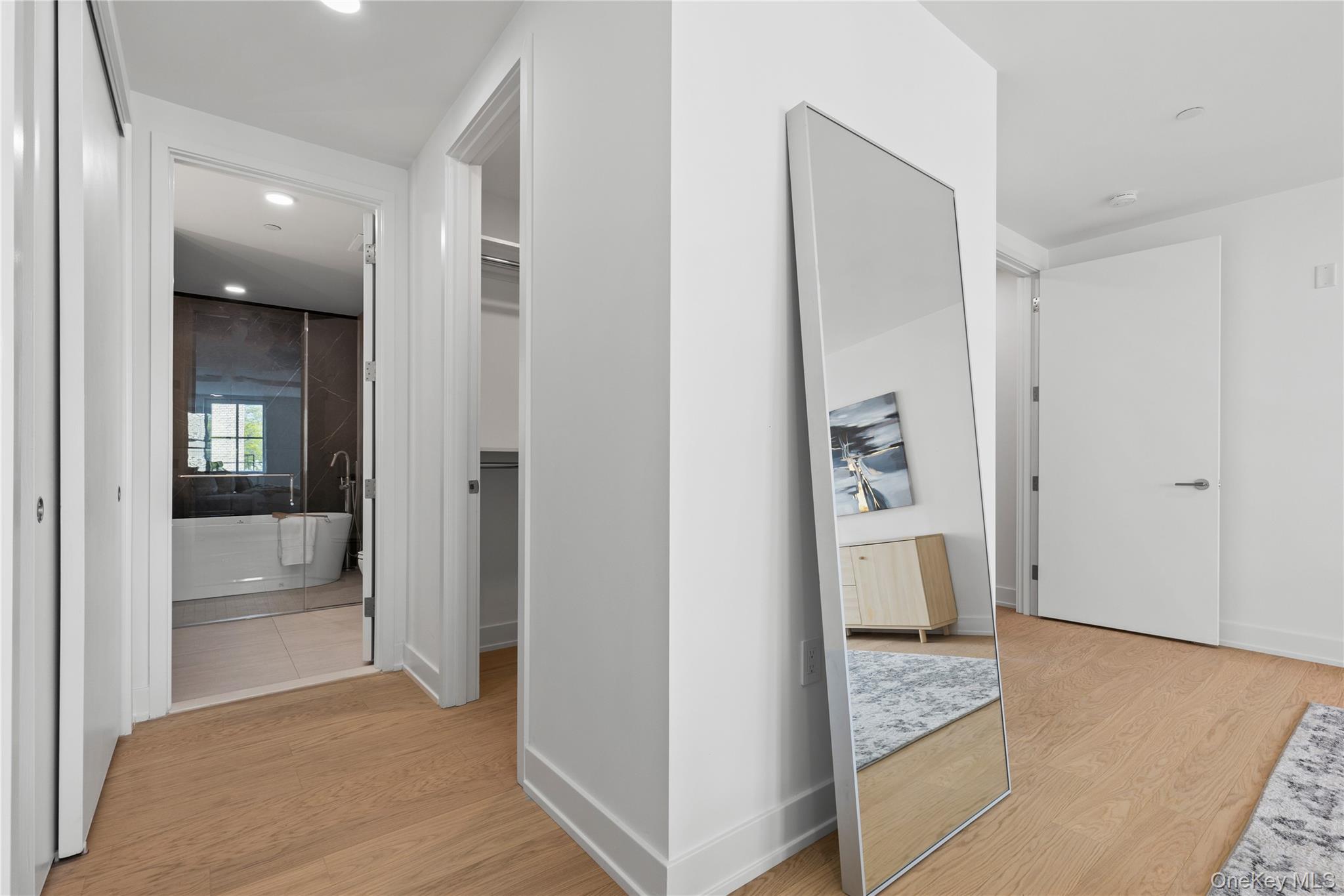 33 Calvert Street, Unit TH7 Harrison, NY 10528 - Photo 11 of 16 a view of livingroom with hardwood floor and hallway