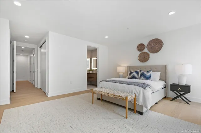 a bedroom with a bed and cabinets