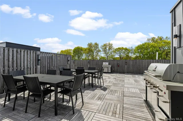 a view of a dinning table and chairs in the patio
