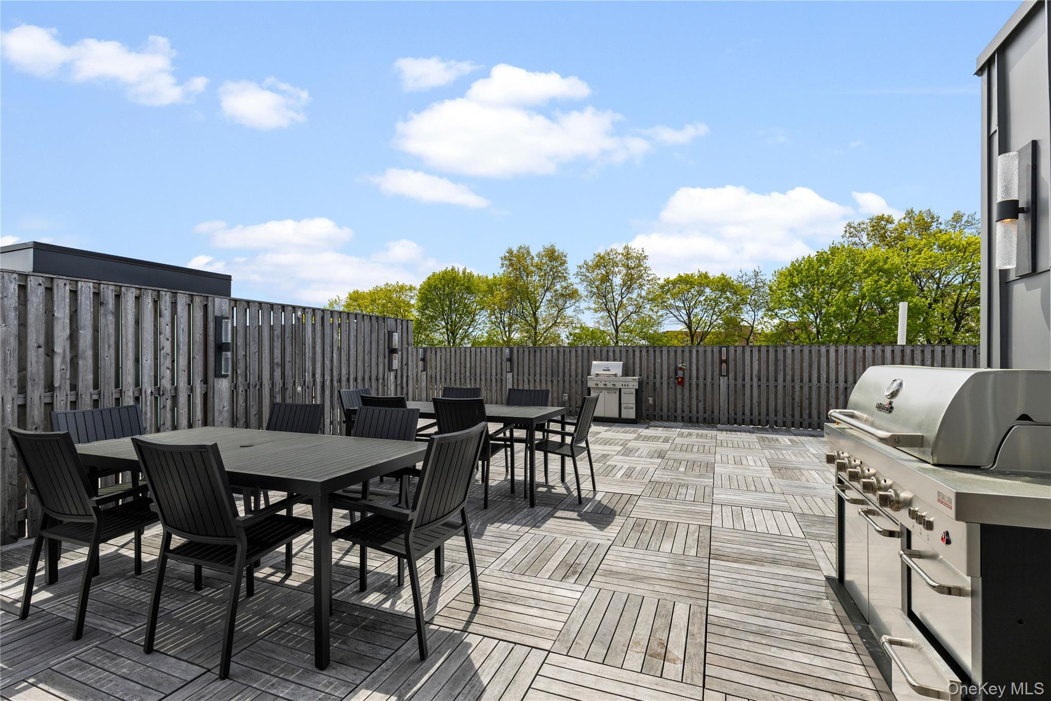 33 Calvert Street, Unit TH7 Harrison, NY 10528 - Photo 15 of 16 a view of a dinning table and chairs in the patio