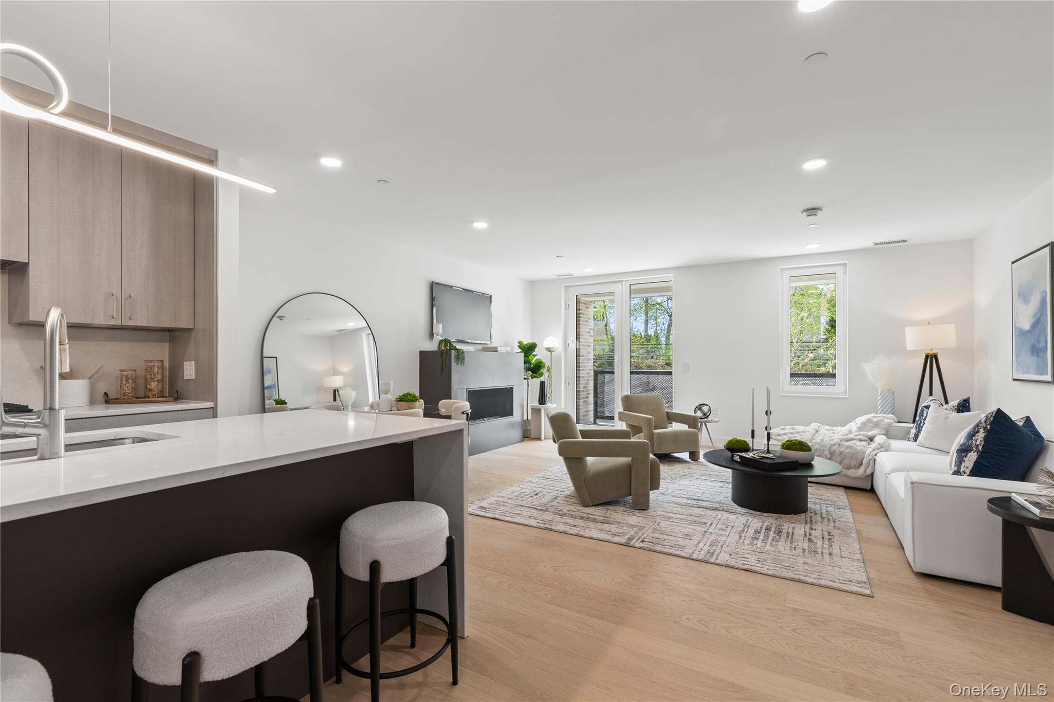 33 Calvert Street, Unit TH7 Harrison, NY 10528 - Photo 5 of 16 a living room with furniture and a large window