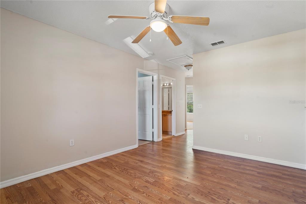 565 Pinehurst Cove Kissimmee, FL 34758 - Photo 13 of 36 a view of empty room with wooden floor