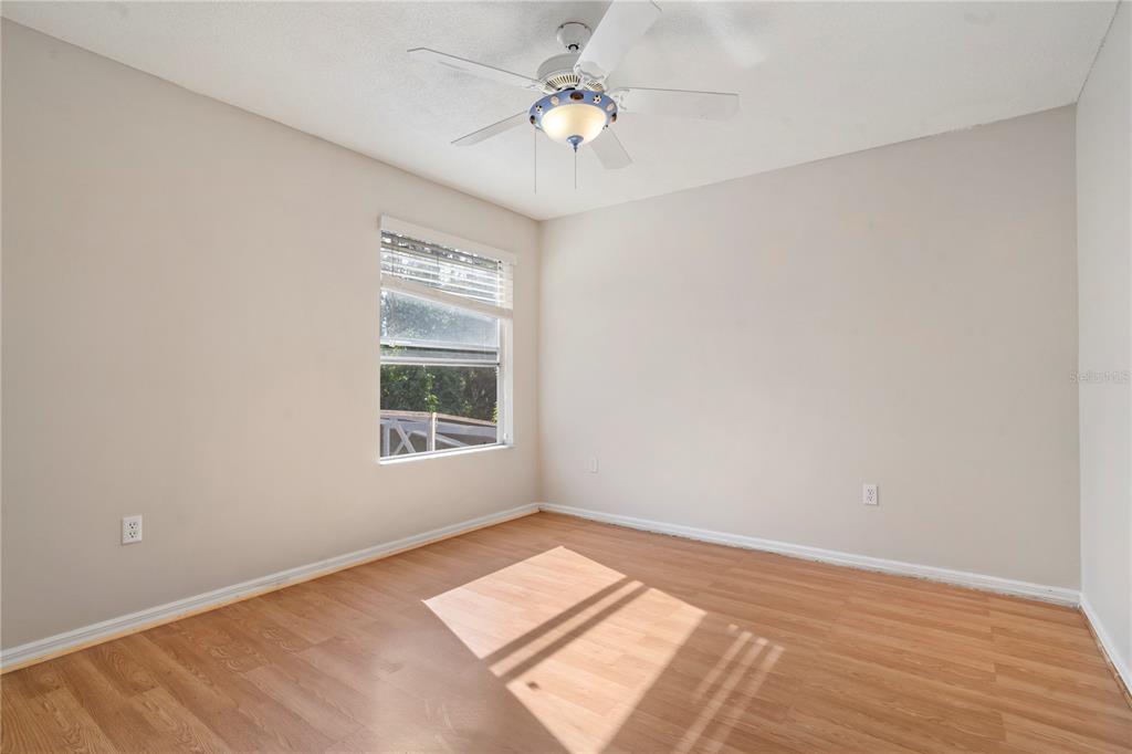 565 Pinehurst Cove Kissimmee, FL 34758 - Photo 17 of 36 a view of an empty room with a window