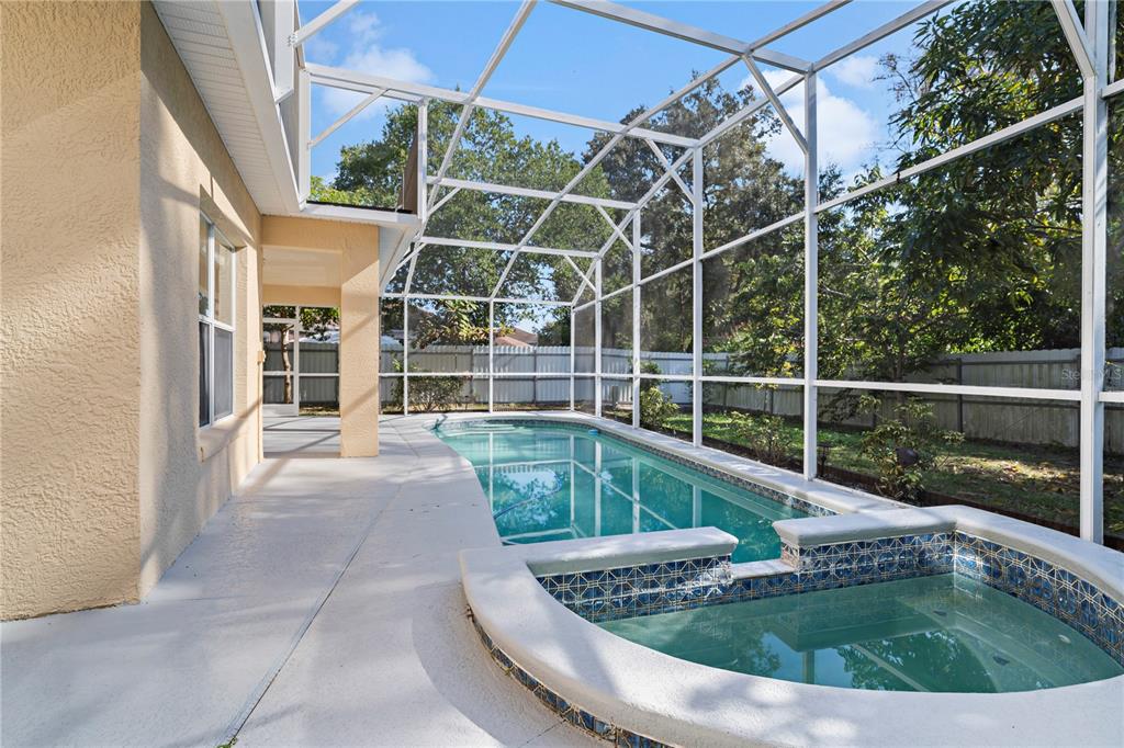 565 Pinehurst Cove Kissimmee, FL 34758 - Photo 22 of 36 a view of a chair and table in the balcony