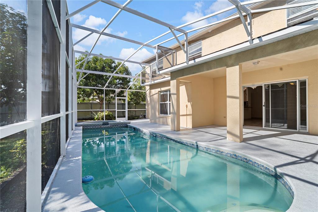 565 Pinehurst Cove Kissimmee, FL 34758 - Photo 23 of 36 a swimming pool with a outdoor seating