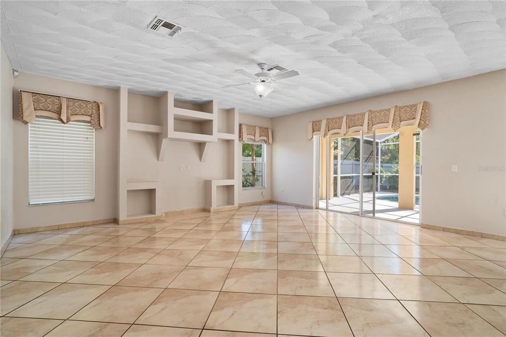 565 Pinehurst Cove Kissimmee, FL 34758 - Photo 27 of 36 a view of an empty room with a window