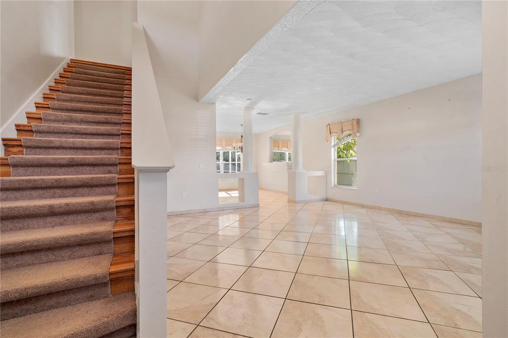 565 Pinehurst Cove Kissimmee, FL 34758 - Photo 30 of 36 a view of an empty room with windows