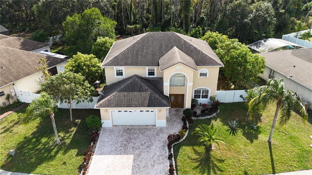 565 Pinehurst Cove Kissimmee, FL 34758 - Photo 36 of 36 a front view of a house with a yard