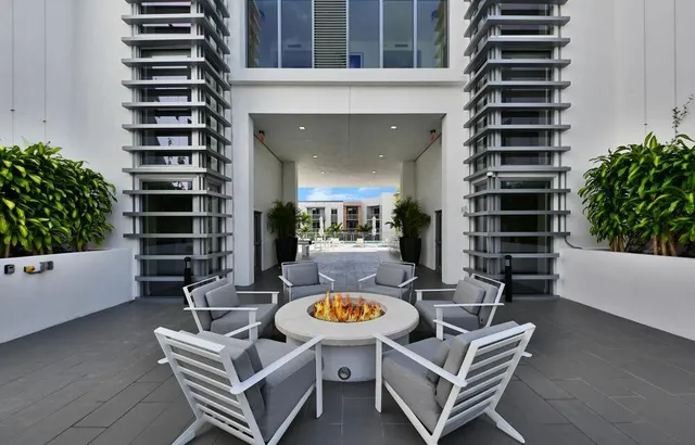 a view of outdoor kitchen outdoor dining space and seating area
