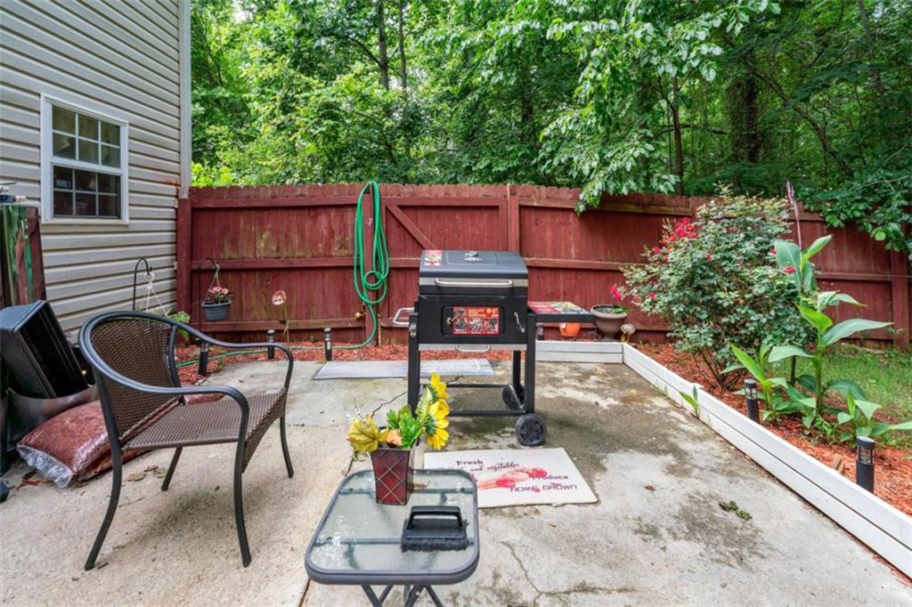 248 Springbottom Drive Southeast Lawrenceville, GA 30046 - Photo 29 of 32 a backyard of a house with seating space
