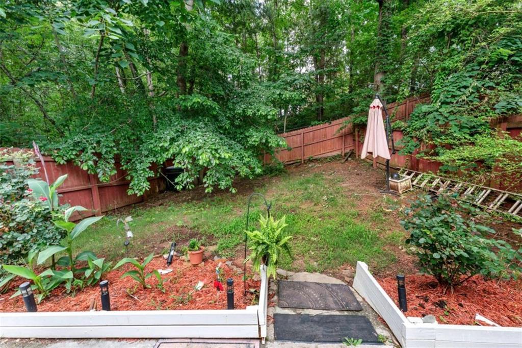 248 Springbottom Drive Southeast Lawrenceville, GA 30046 - Photo 30 of 32 a backyard of a house with lots of green space