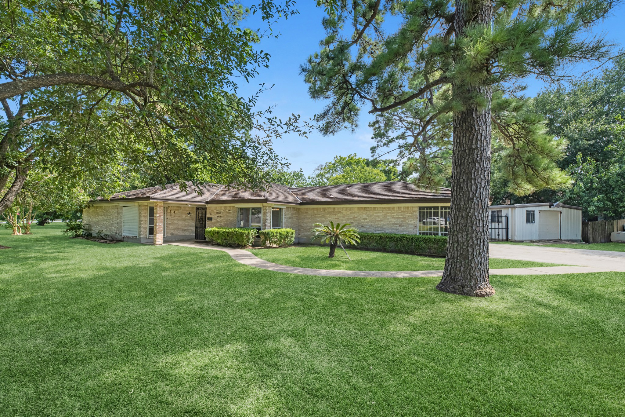 1109 Becker Street Channelview, TX 77530 - Photo 2 of 49 a front view of a house with garden
