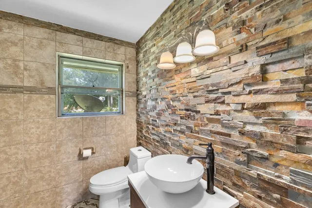 a view of a bedroom with cabinet and windows