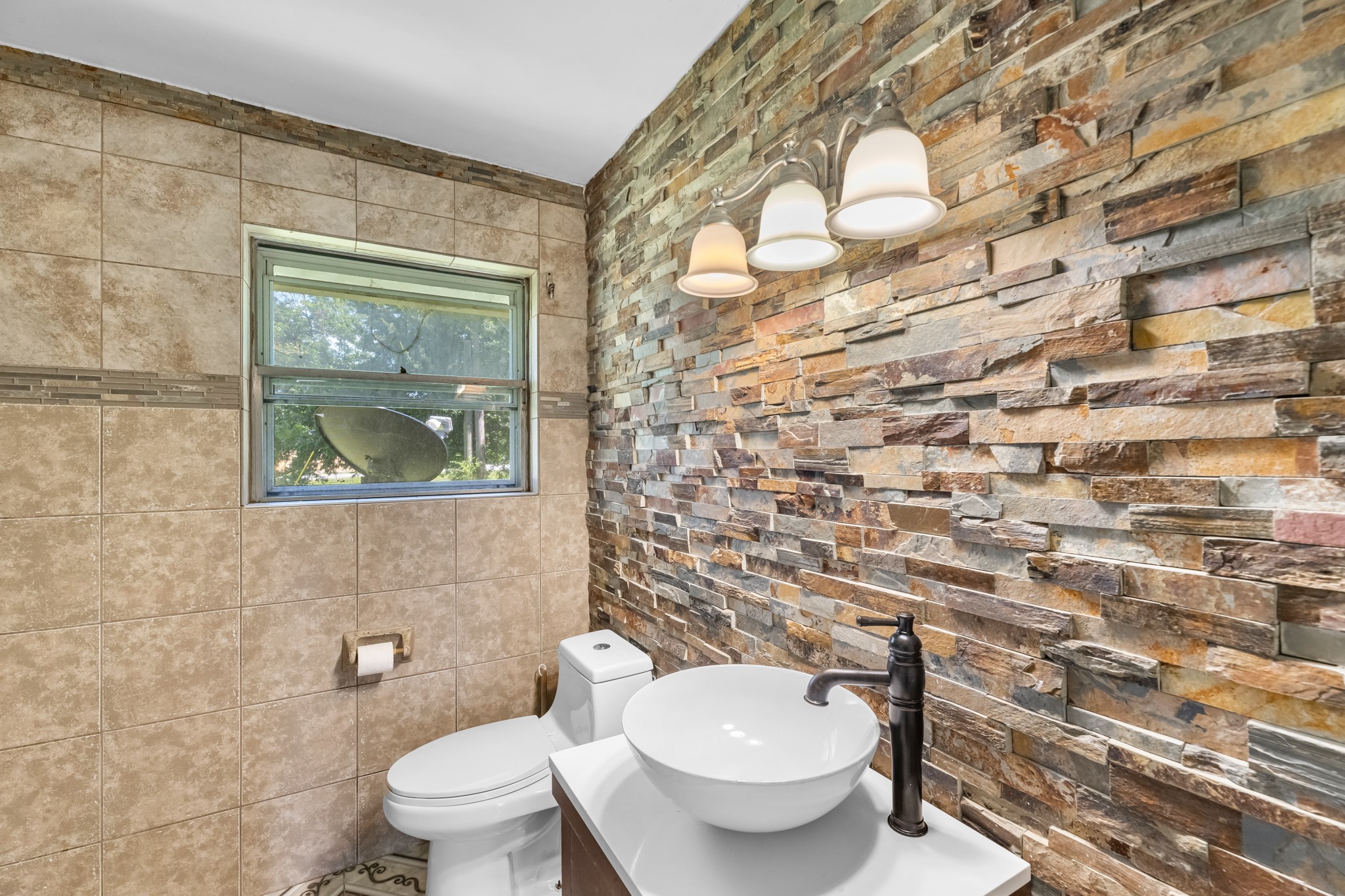 1109 Becker Street Channelview, TX 77530 - Photo 26 of 49 a white toilet sitting next to a shower curtain