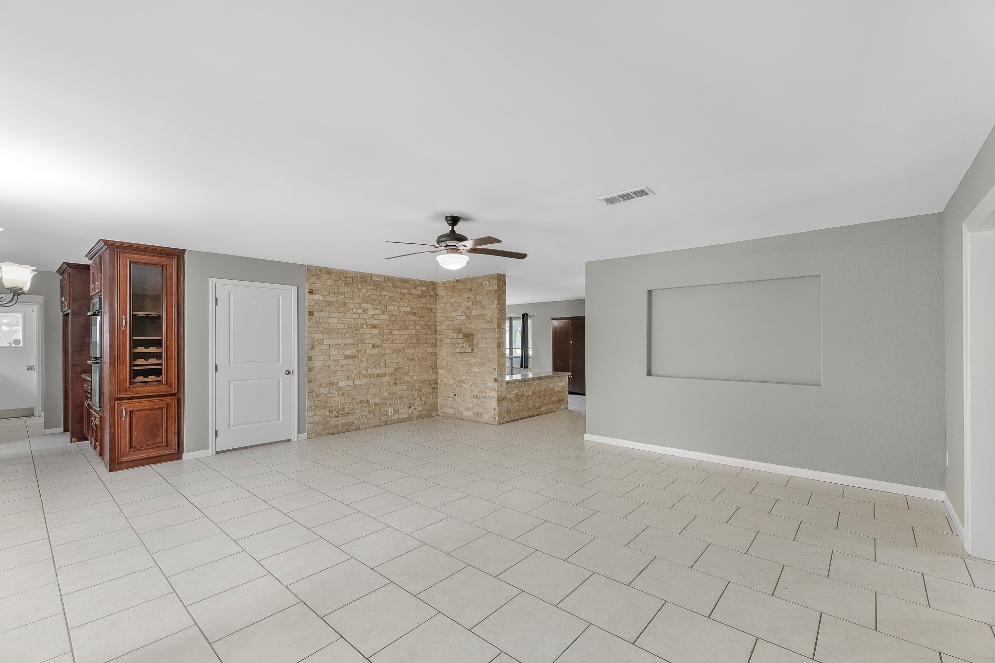 1109 Becker Street Channelview, TX 77530 - Photo 9 of 49 an empty room with a empty space and windows