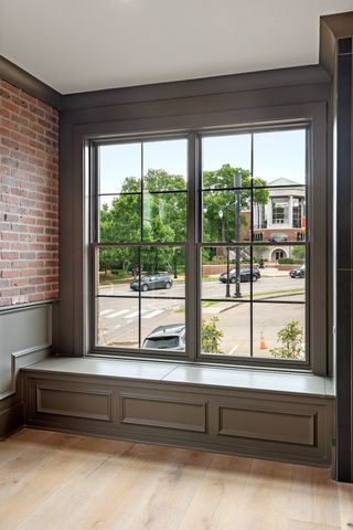 a bathroom with a large window and a bathtub
