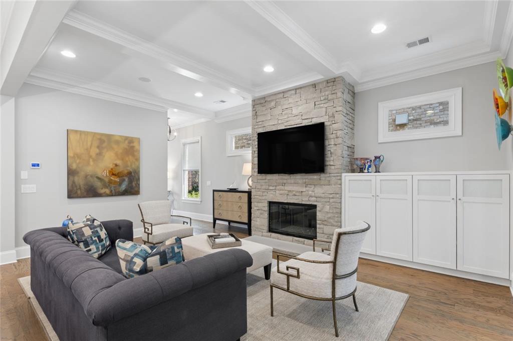 317 Riversedge Drive Atlanta, GA 30339 - Photo 11 of 68 a living room with furniture a fireplace and a flat screen tv