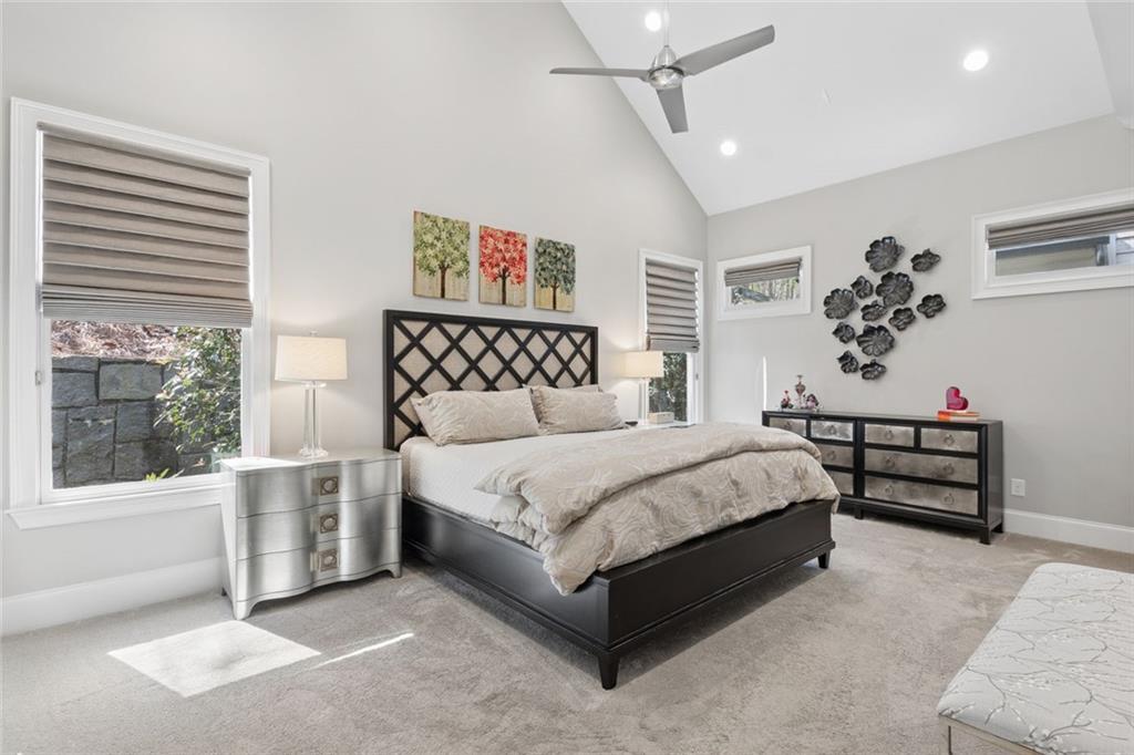 317 Riversedge Drive Atlanta, GA 30339 - Photo 26 of 68 a bedroom with a bed lamp and window