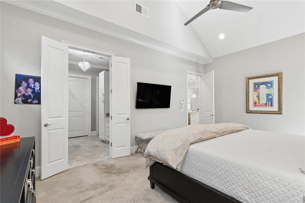 317 Riversedge Drive Atlanta, GA 30339 - Photo 27 of 68 a bedroom with a bed and a flat screen tv