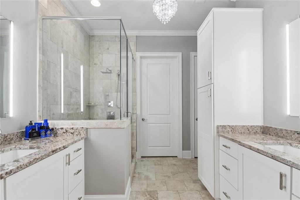 317 Riversedge Drive Atlanta, GA 30339 - Photo 28 of 68 a bathroom with a granite countertop sink and a mirror