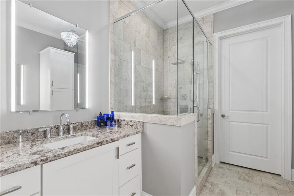317 Riversedge Drive Atlanta, GA 30339 - Photo 29 of 68 a bathroom with double sink and a mirror