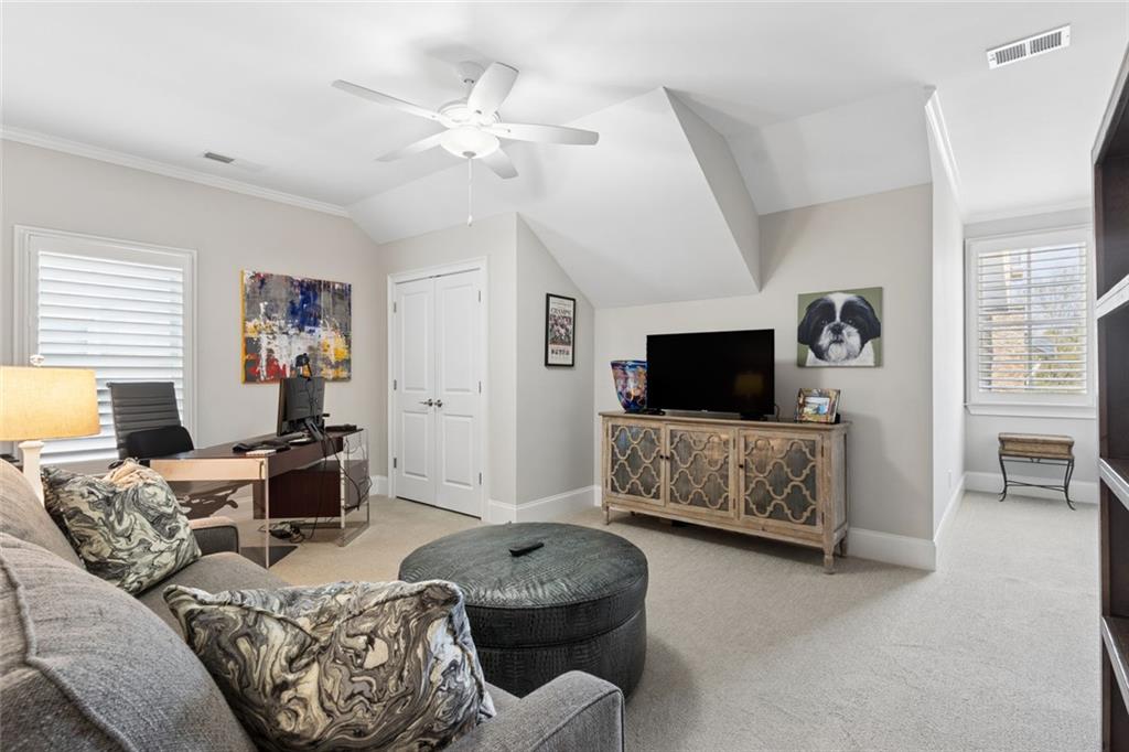317 Riversedge Drive Atlanta, GA 30339 - Photo 39 of 68 a living room with furniture and a flat screen tv