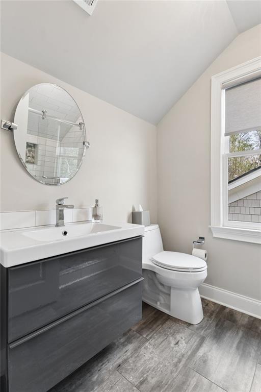317 Riversedge Drive Atlanta, GA 30339 - Photo 42 of 68 a bathroom with a toilet a sink and mirror