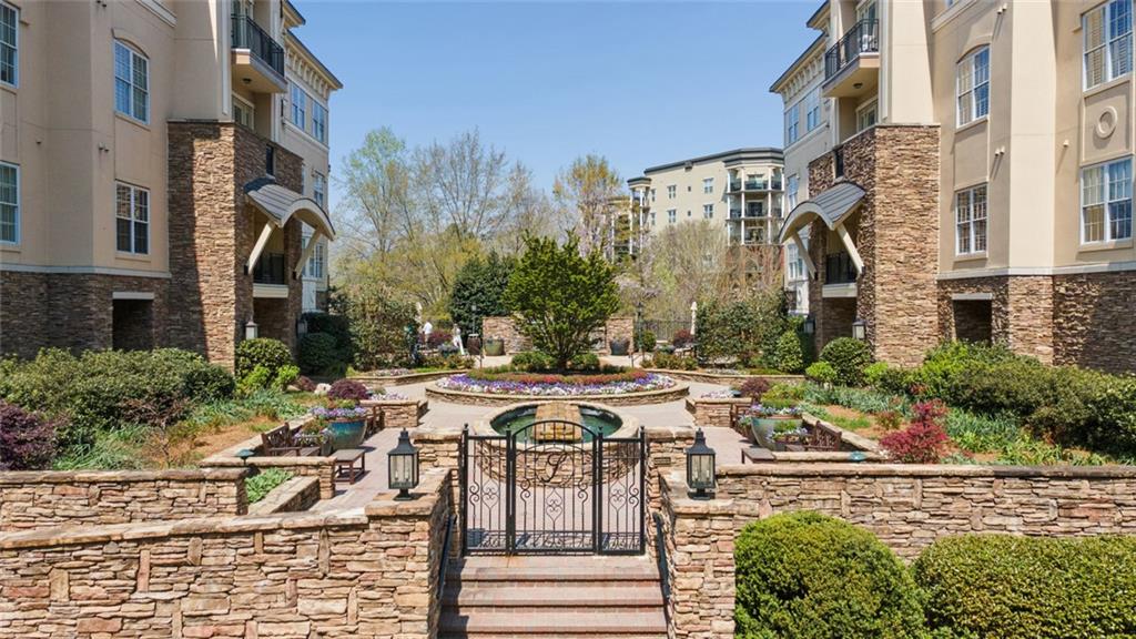 317 Riversedge Drive Atlanta, GA 30339 - Photo 45 of 68 a view of a patio with couches table and chairs and potted plants
