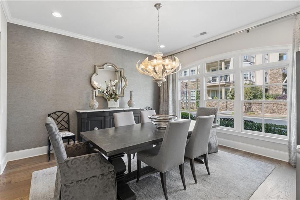 317 Riversedge Drive Atlanta, GA 30339 - Photo 6 of 68 a view of a dining room with furniture a chandelier and wooden floor