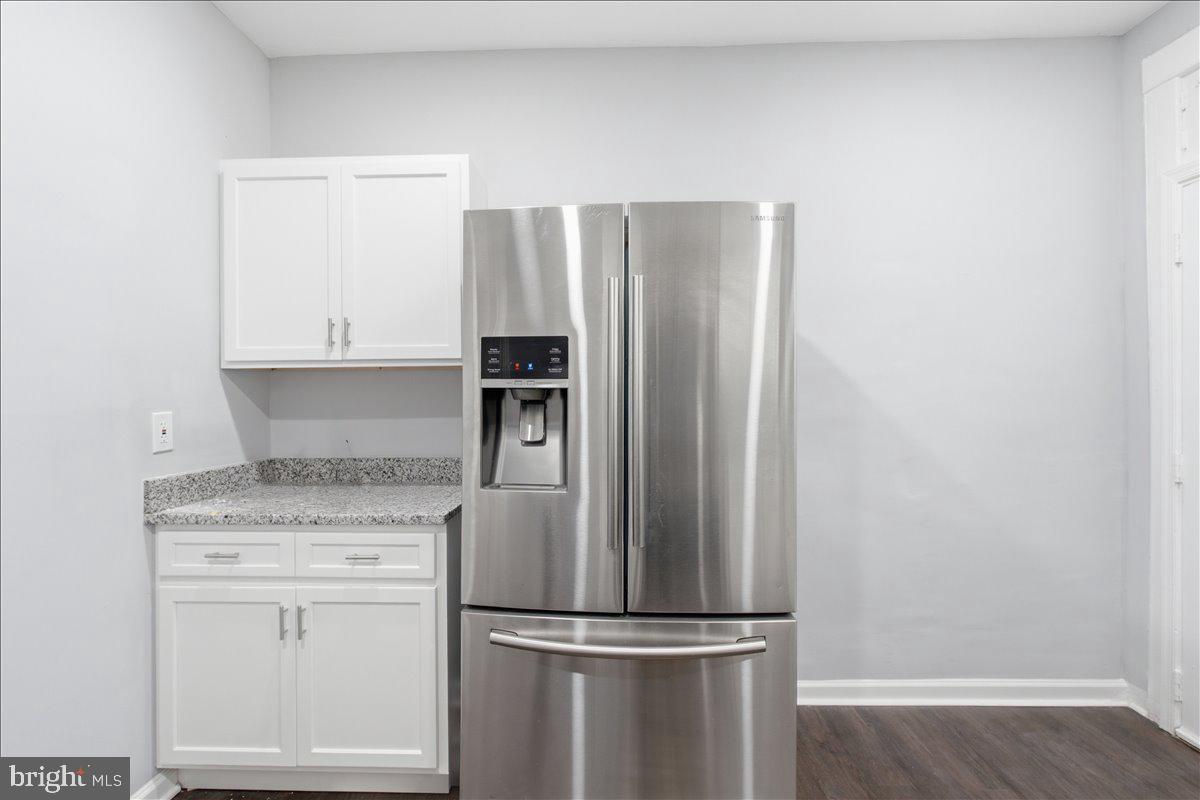 1231 North Potomac Street Baltimore, MD 21213 - Photo 10 of 25 a kitchen with appliances a refrigerator and cabinets